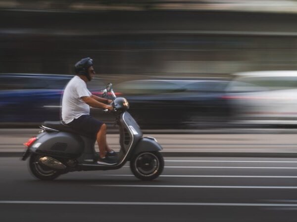 man-in-white-shirt-and-black-pants-riding-on-black-motor-scooter_cdd0a4b9592624ac201163c2b07496bb_800