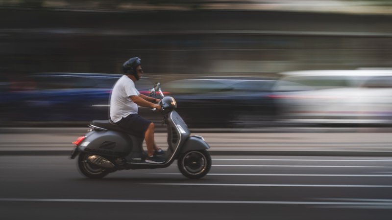 man-in-white-shirt-and-black-pants-riding-on-black-motor-scooter_cdd0a4b9592624ac201163c2b07496bb_800